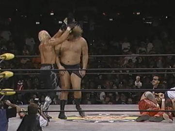 Hogan Hits Belt On Giant's Head